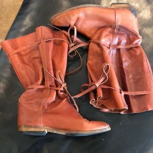 Unique rust leather funky boots. Adjustable leather ties. Made in Italy.